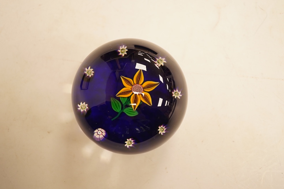 A boxed Paul Ysart floral paperweight, 7cm in diameter